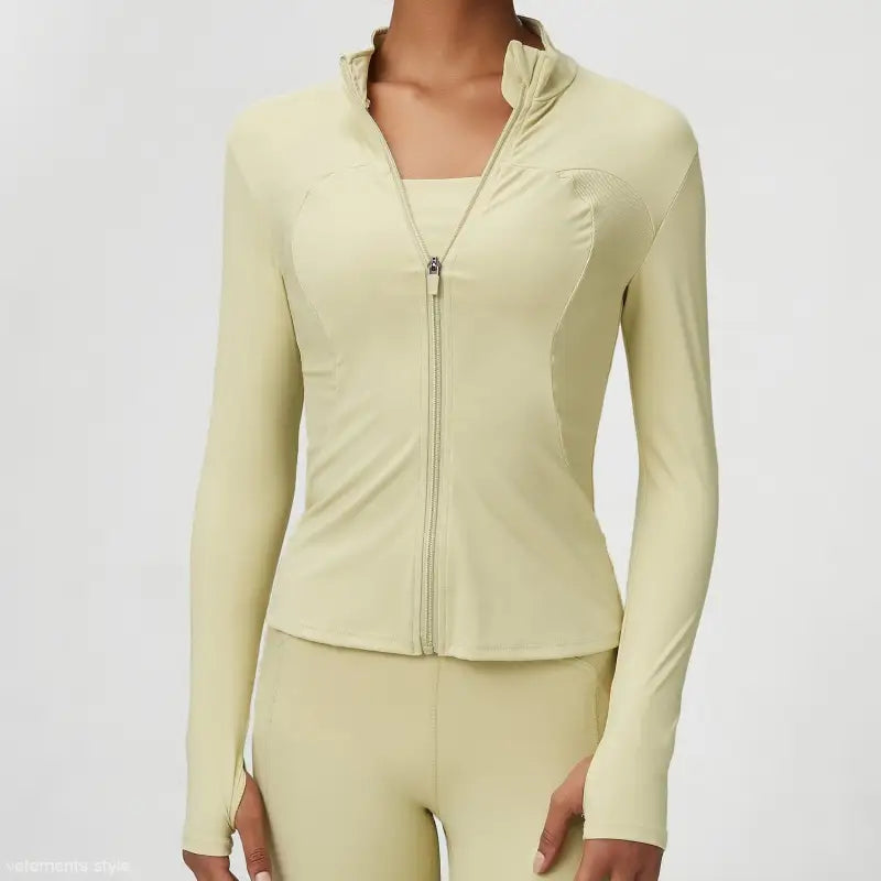 Light green athletic jacket with thumb holes, featuring a matcha green tight waist design
