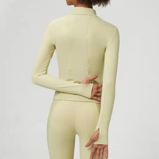 Light green athletic wear set featuring a matcha green long sleeve coat with tight waist design