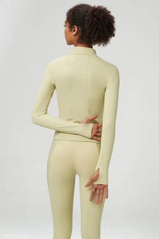 Light green athletic wear set featuring a matcha green long sleeve coat with tight waist design