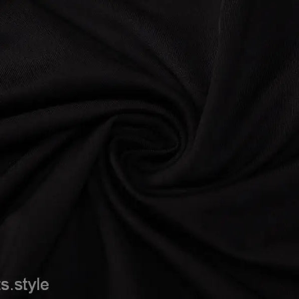 Black fabric with swirling folds in a Metal Chain Halter Maxi Dress for summer events