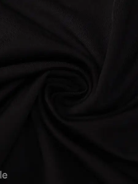 Metal chain halter maxi dress with black fabric swirling folds and cutout design