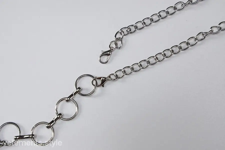 Silver metal chain belt accentuating the Metal Chain Halter Maxi Dress for summer parties