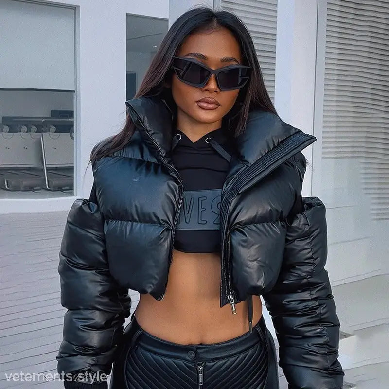 Cropped black puffer jacket from Modern Cotton Coat Cutout for winter elegance