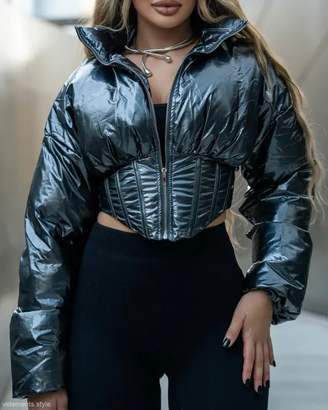 Shiny black puffer jacket with corset detail in a modern winter coat cutout design