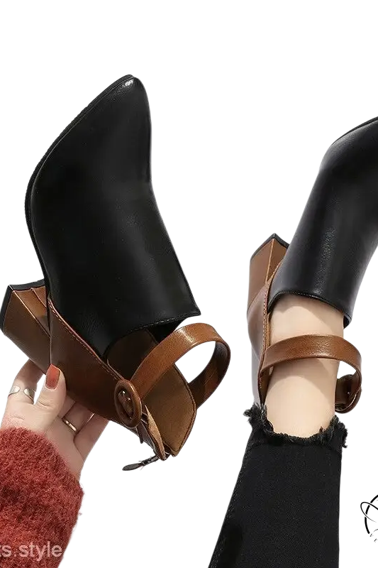 Pair of black high ankle modern booties with brown leather straps and square heel