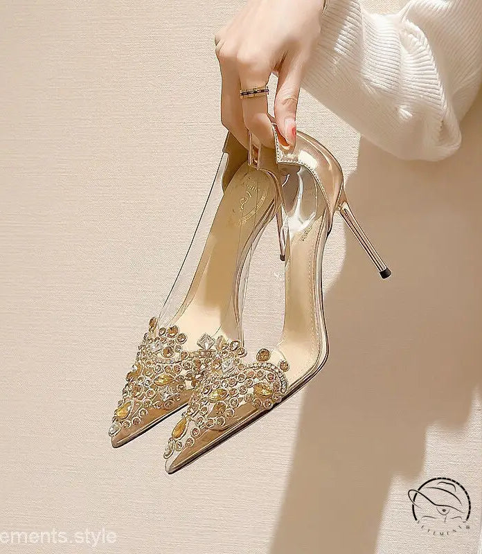 Pair of transparent 8cm high-heeled shoes with champagne pearl embellishments