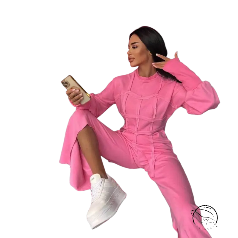 Woman in vibrant pink modern hoodie sets posing with drink