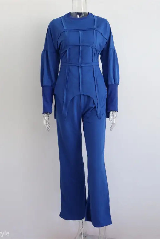 Blue long-sleeved jumpsuit with structured bodice and flared pants, perfect modern hoodie sets