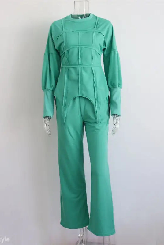 Mint green modern hoodie set with long sleeves and full-length pants on mannequin