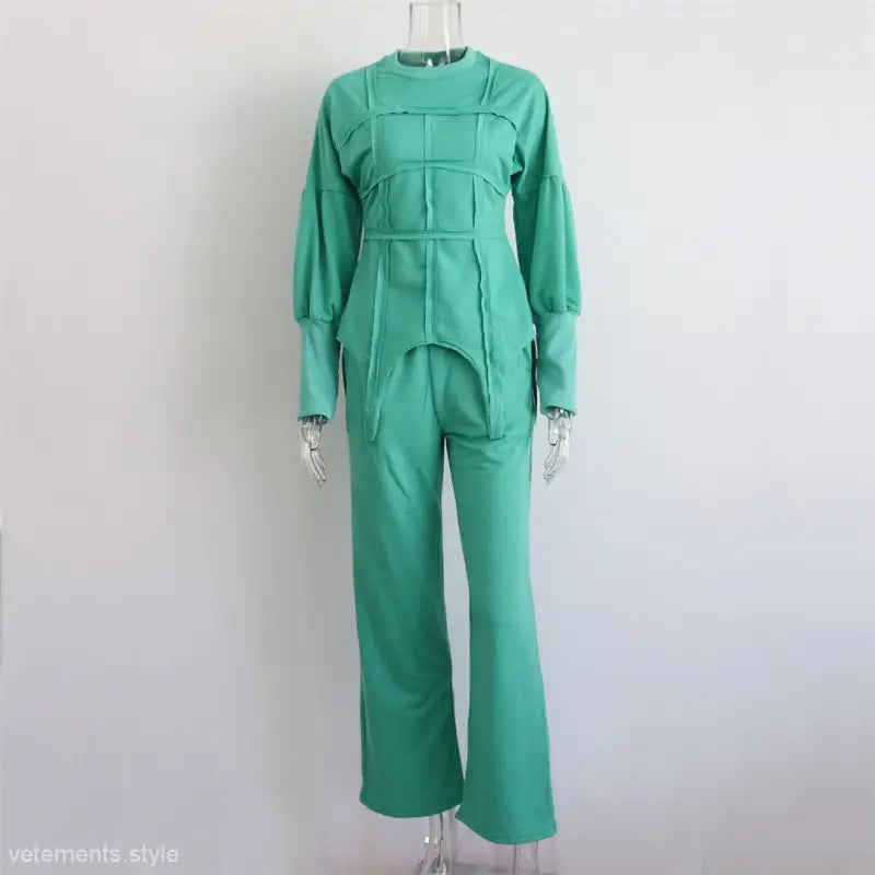 Mint green modern hoodie set with long sleeves and full-length pants on mannequin