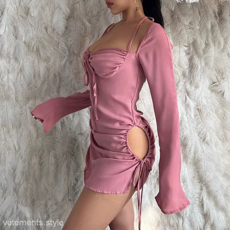 Pink long-sleeved mini dress with ruched details, perfect for spring and summer parties