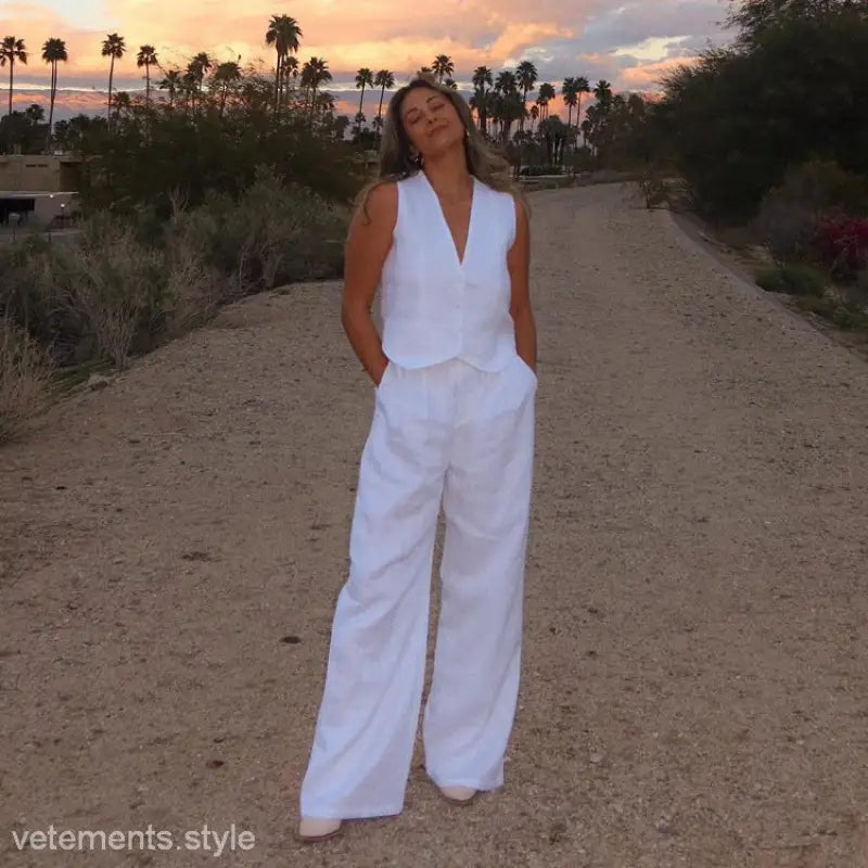 Woman in Monaco Summer Outfit with cotton linen waistcoat and wide-leg linen trousers