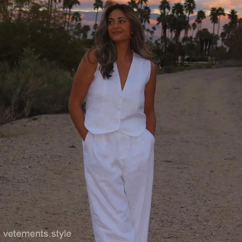 Woman in Monaco Summer Outfit with white cotton linen waistcoat and wide-leg trousers
