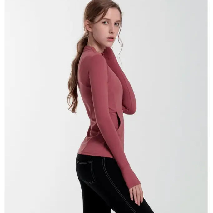 Woman in navy blue slim-fit yoga jacket with lace and tulle sleeves for activewear