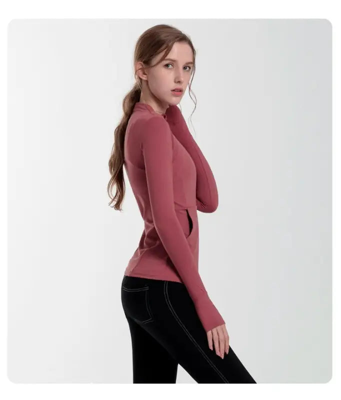 Woman in navy blue slim-fit yoga jacket with lace and tulle sleeves for activewear