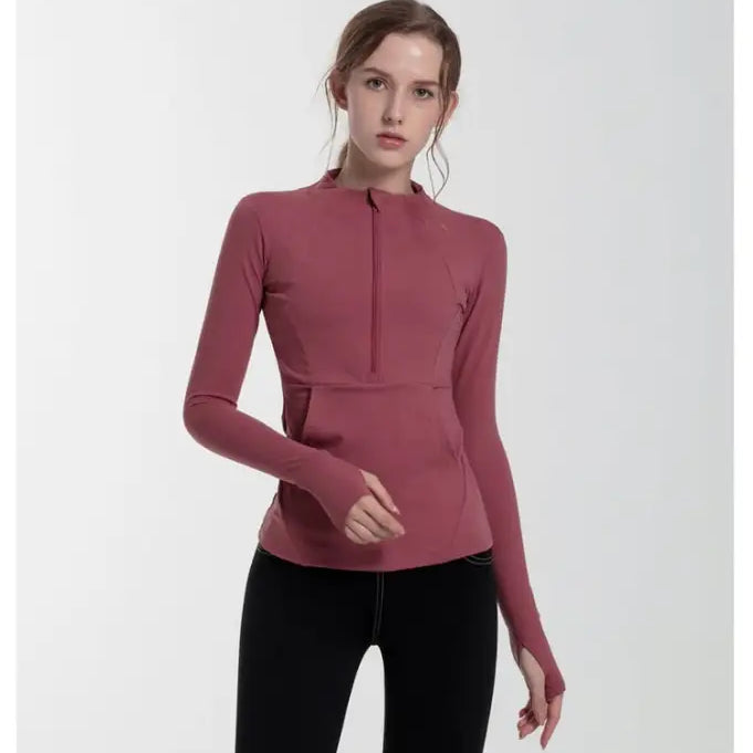 Woman in navy blue slim-fit yoga jacket with lace and tulle sleeves, coral red accents