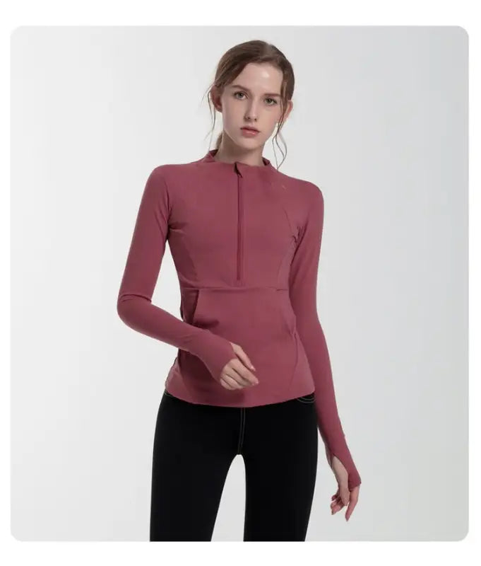 Woman in navy blue slim-fit yoga jacket with lace and tulle sleeves, coral red accents