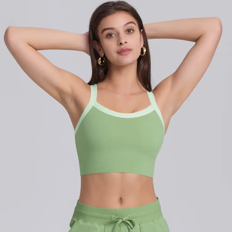 Green ribbed crop top displayed on Navy Blue Sporty Slim Nylon Strength Yoga Bra for all seasons