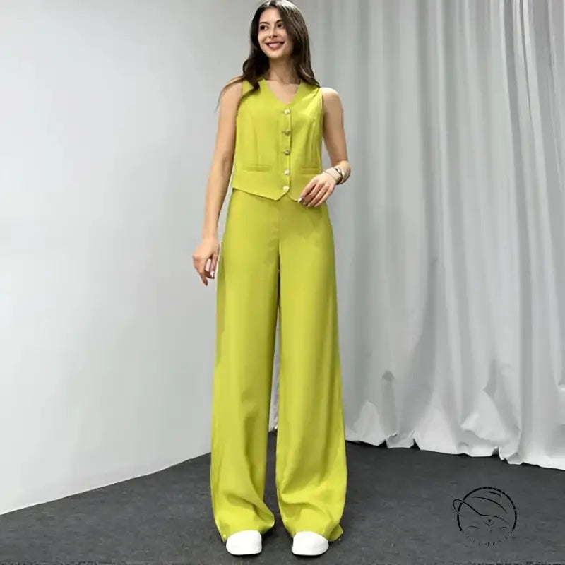 Woman in navy blue summer high grade casual suit with yellowish green vest and trousers
