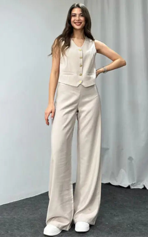 Model wearing beige sleeveless vest and wide-leg trousers from Navy Blue Summer High Grade Casual Suit