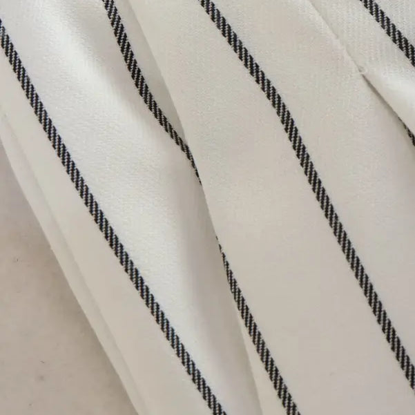 White fabric with thin black diagonal pinstripes, part of Office Style Slim White Suit with Gray Trousers