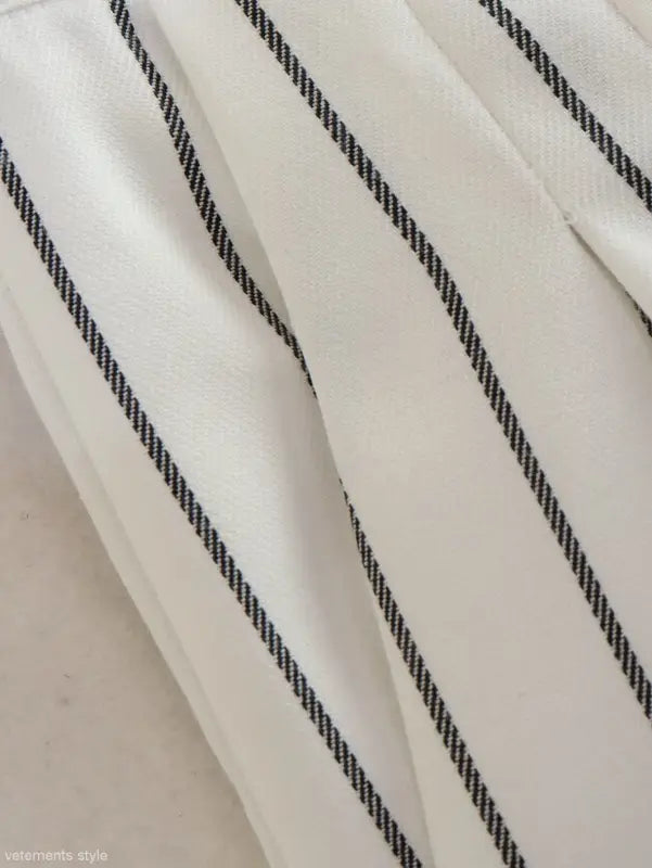 White fabric with thin black diagonal pinstripes, part of Office Style Slim White Suit with Gray Trousers