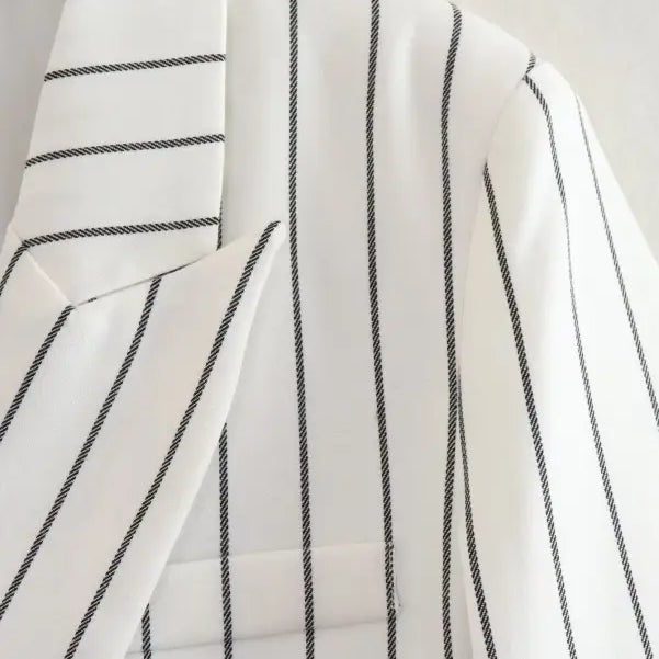 White fabric with thin black vertical stripes for office style slim white suit with gray trousers