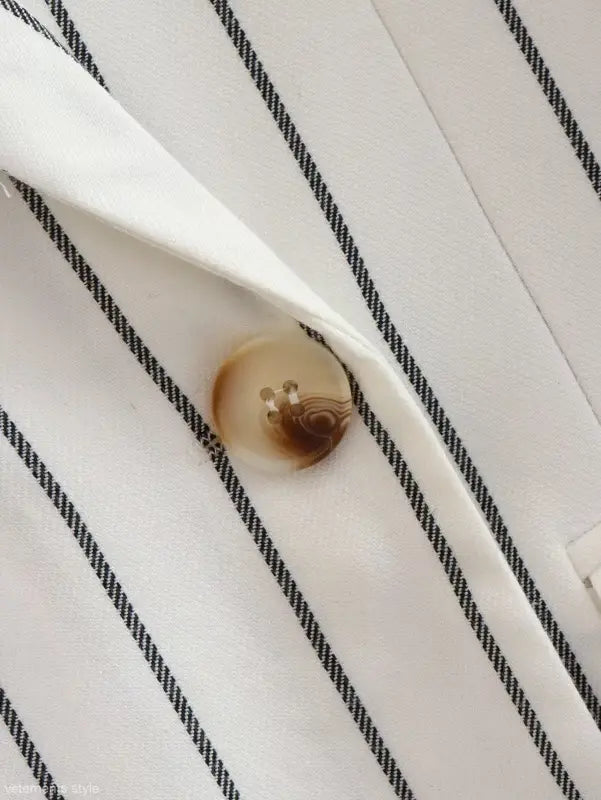 Button on white fabric with thin black stripes from Office Style Slim White Suit with Gray Trousers