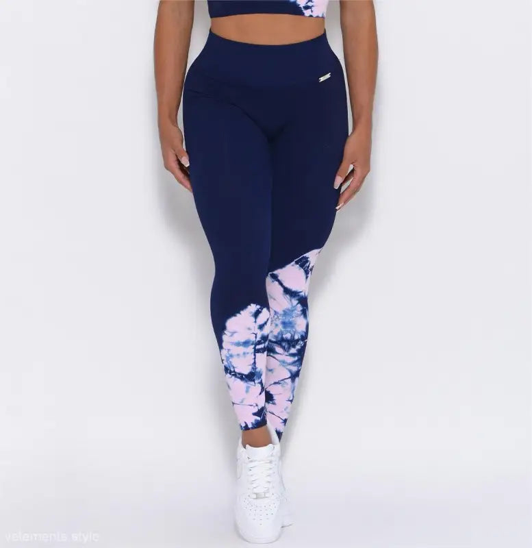 Navy blue Peachy Fit Leggings with tie-dye pattern at the bottom and white sneakers