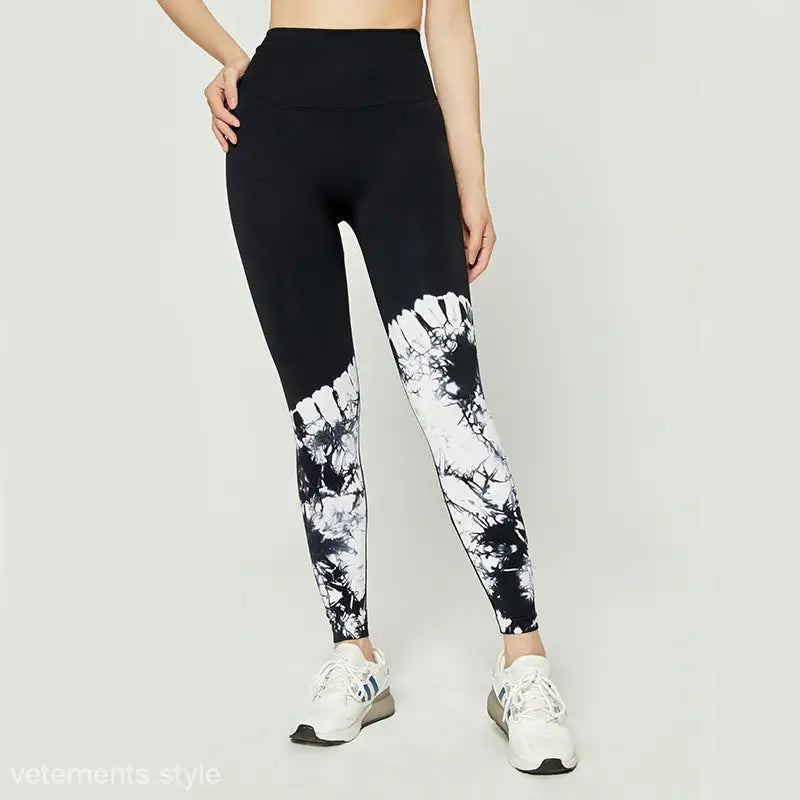 Black leggings with white tie-dye pattern, high waist stretch, paired with white sneakers