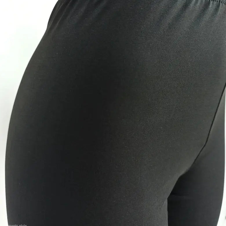 Black leggings from the hip area paired with Casual Short Sleeve Top for summer wear
