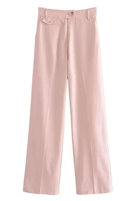 Pale pink wide-leg pink pants paired with a short blazer high for a stylish look