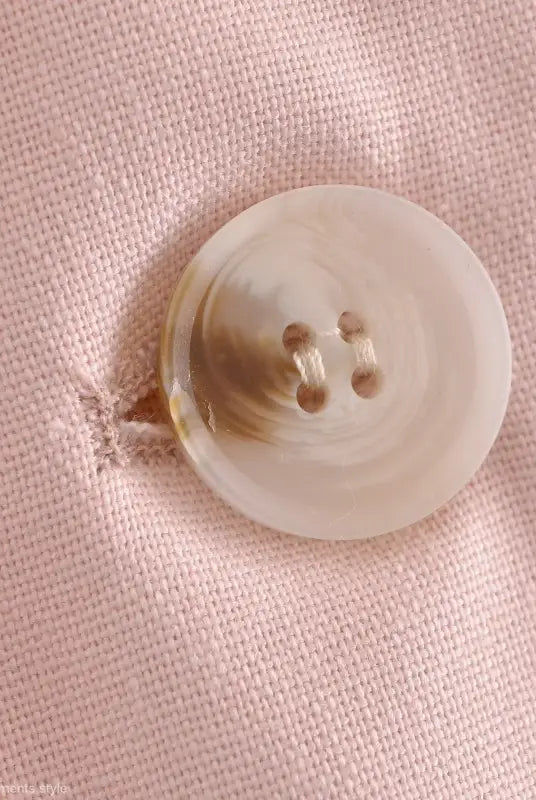 Round four-hole pink button displayed on Pink Pants and Top Blazer High in linen blend short style