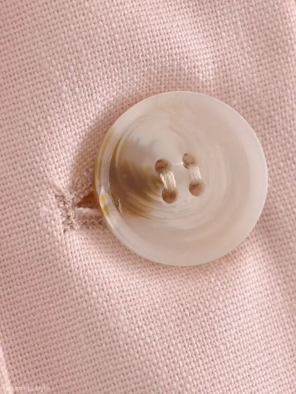 Round four-hole pink button displayed on Pink Pants and Top Blazer High in linen blend short style