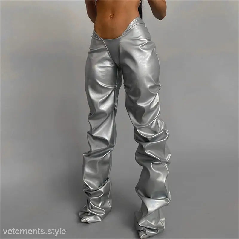 Shiny silver polyester straight pants with a loose fit, wrinkled texture, and sexy low waist style