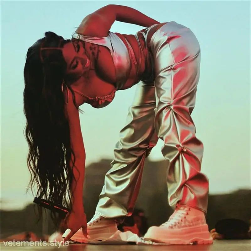 Woman in a white outfit with flowing hair striking a dramatic dance pose wearing Polyester Straight Pants