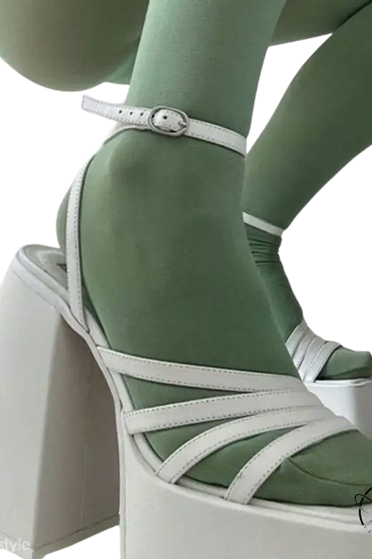 White ankle strap heel with strappy design and mint green socks