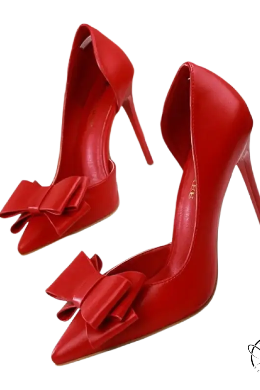 Elegant sweet high-heeled pumps in red patent leather with bow toe