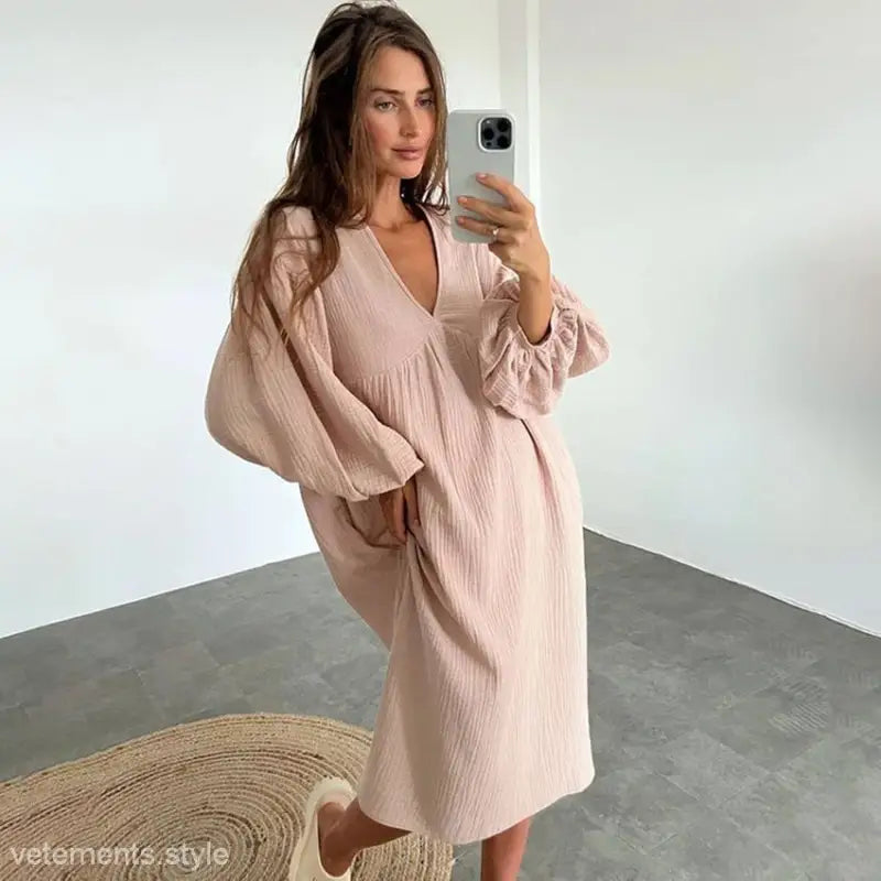 Pale pink loose-fitting dress with voluminous sleeves and v-neckline, ideal for pure cotton confinement wear