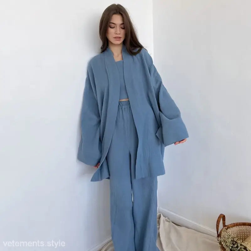 Woman in light blue pure cotton pajamas with belted sleeves and wide-leg pants ensemble