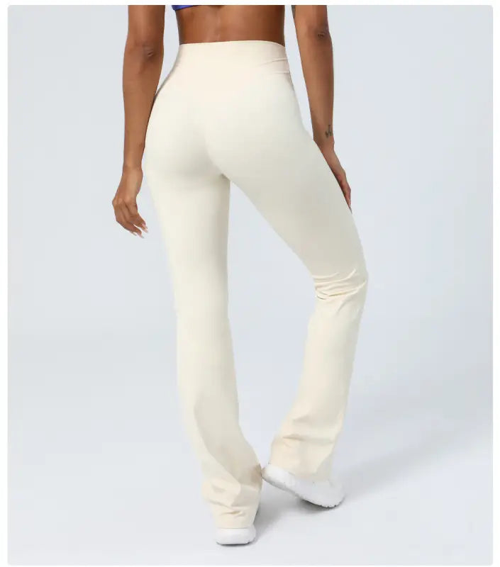 Cream-colored high-waisted flared yoga pants, ideal as casual flared yoga pants