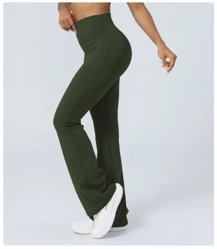 Olive green high-waisted flared leggings styled as casual flared yoga pants for active wear