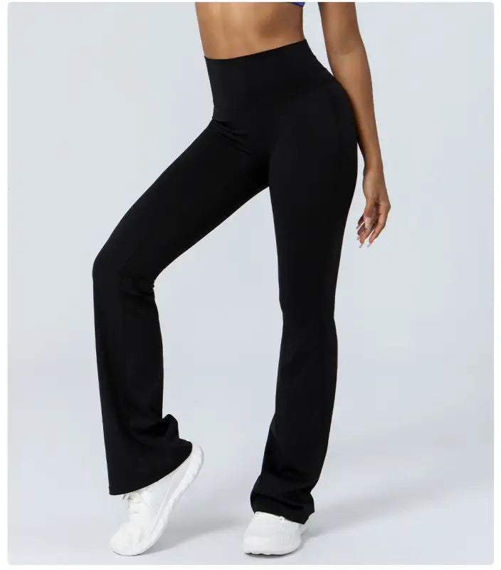 Black flared leggings as part of purplish blue flared yoga pants collection for casual wear
