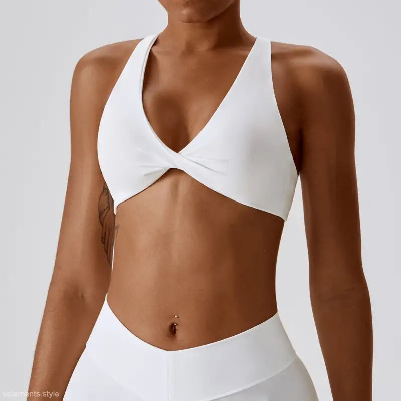 White twisted-front sports bra for quick drying yoga in dark reddish purple and tropical orange