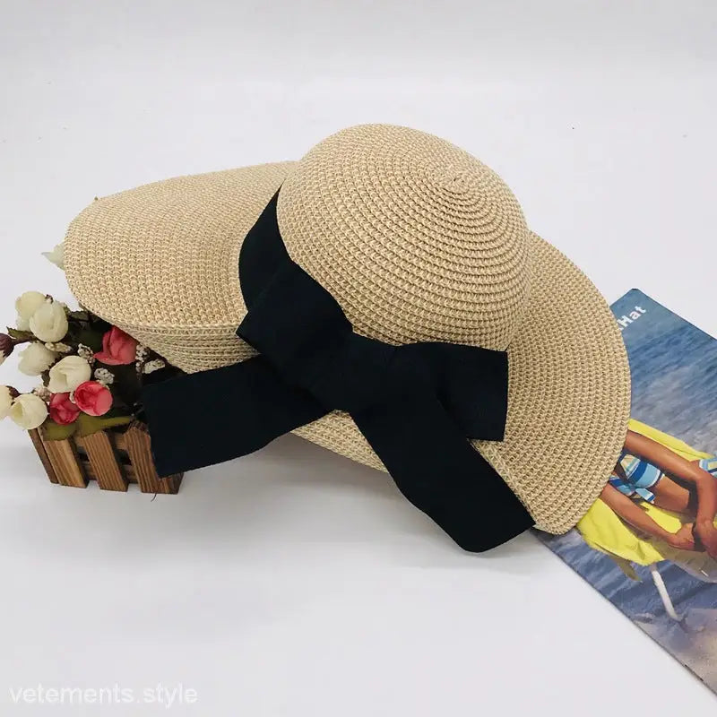Straw sun hat with black ribbon, a stylish Raffia Bucket Hat featuring a big bow sunshade