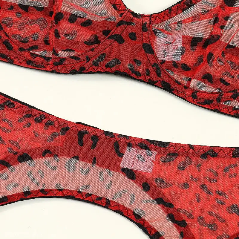 Red leopard print three-piece lace and fishnet bra set with stitched edges
