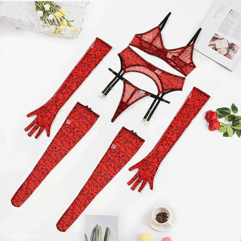 Red leopard print three-piece lace and fishnet lingerie set with matching gloves and stockings