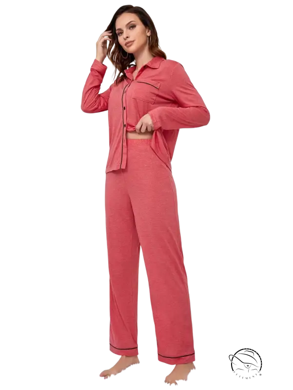 Red long sleeved homewear suit in soft coral with black trim cuffs