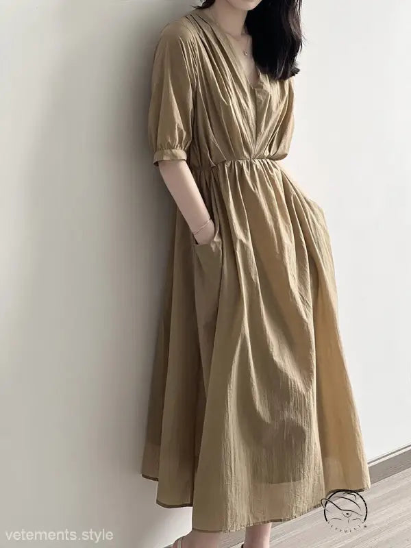 Retro V neck pleated midi dress in flowy beige with cinched waist