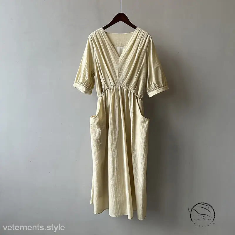 Retro v neck pleated midi dress in cream with V-neck and pockets